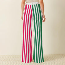 Load image into Gallery viewer, Back view of a pair of Lollipop Lady striped trousers with one pink leg and one green leg