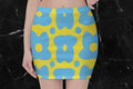 A yellow skirt with blue cartoon flowers