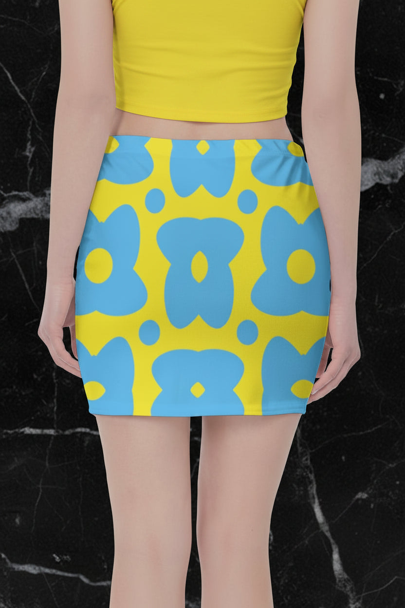 The back view of a yellow skirt with blue cartoon flowers.